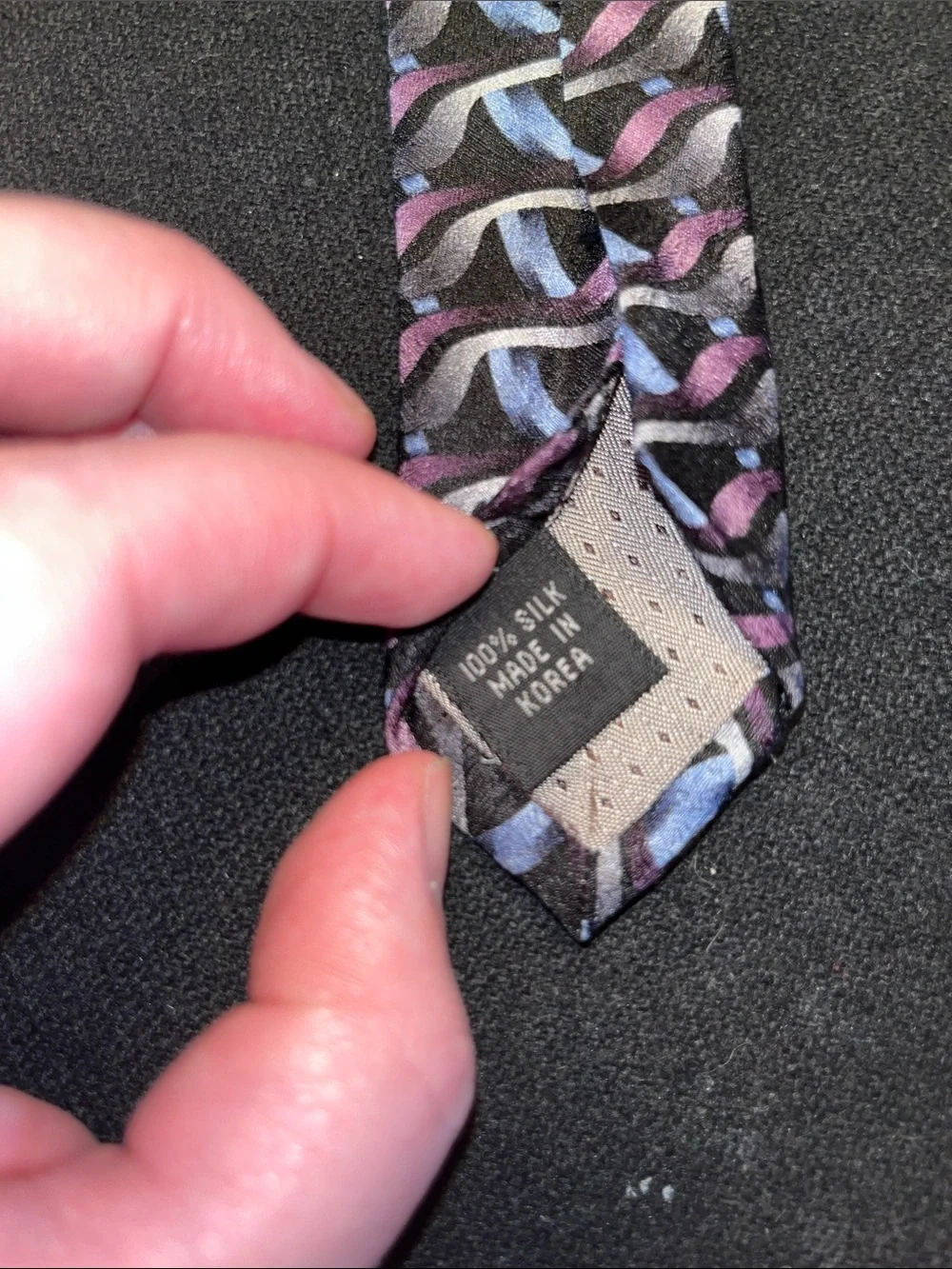 Haggar Black Tie with Purple and Light Blue Wave Motifs